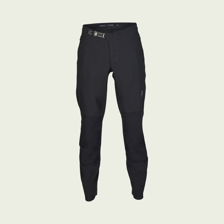 dark mtb pants on green background