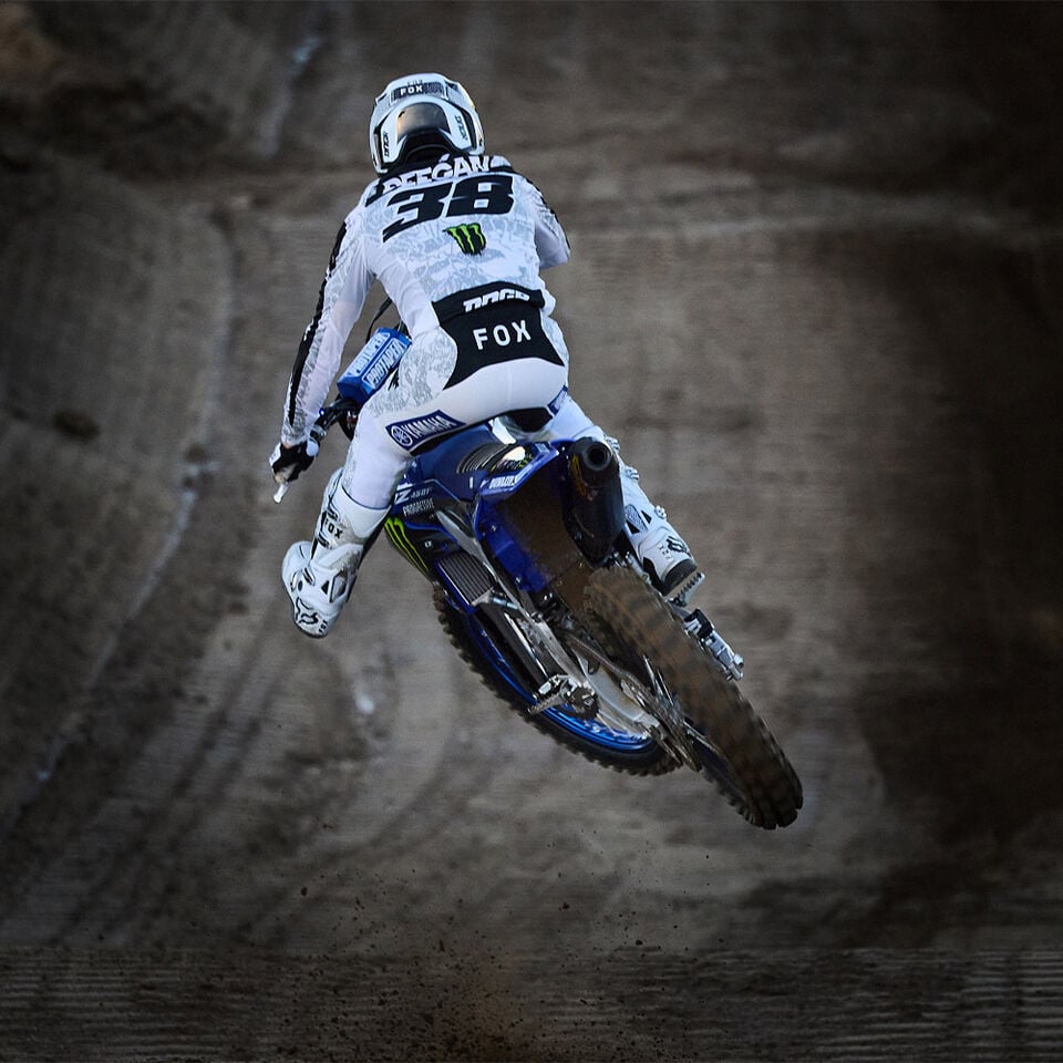 Haiden Deegan racing in a motocross track