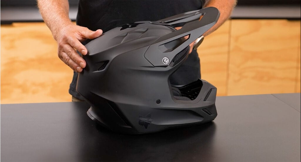 Man holding a V3RS helmet