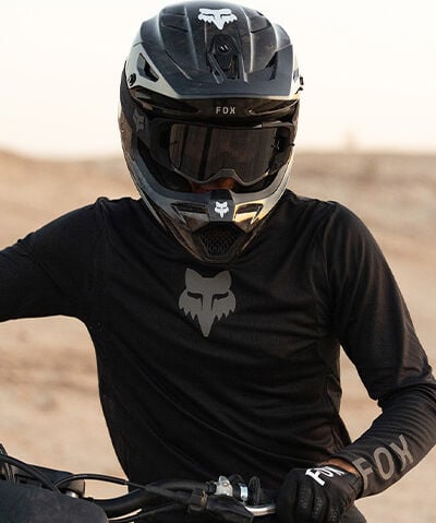 Guy in a black helmet and jersey