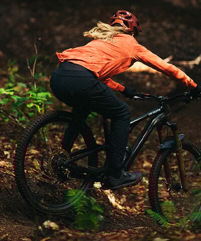 Woman riding DH bike in the Fox Ranger MTB pant