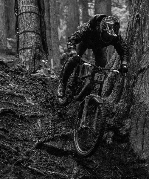 Black and white photo of person riding MTB
