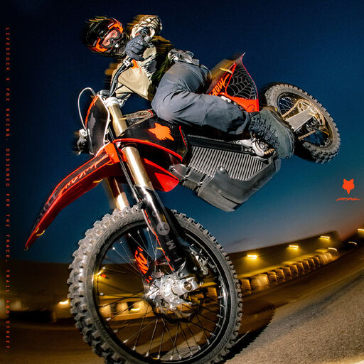 Guy doing a stoppie on a dirt bike.