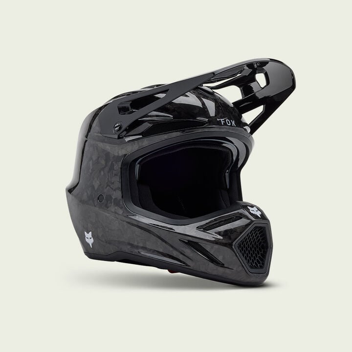 Black V3RS motocross helmet on a white background.