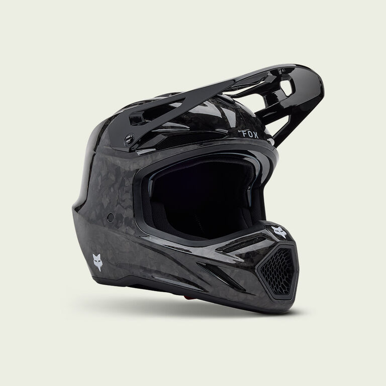 Black V3RS motocross helmet on a white background.