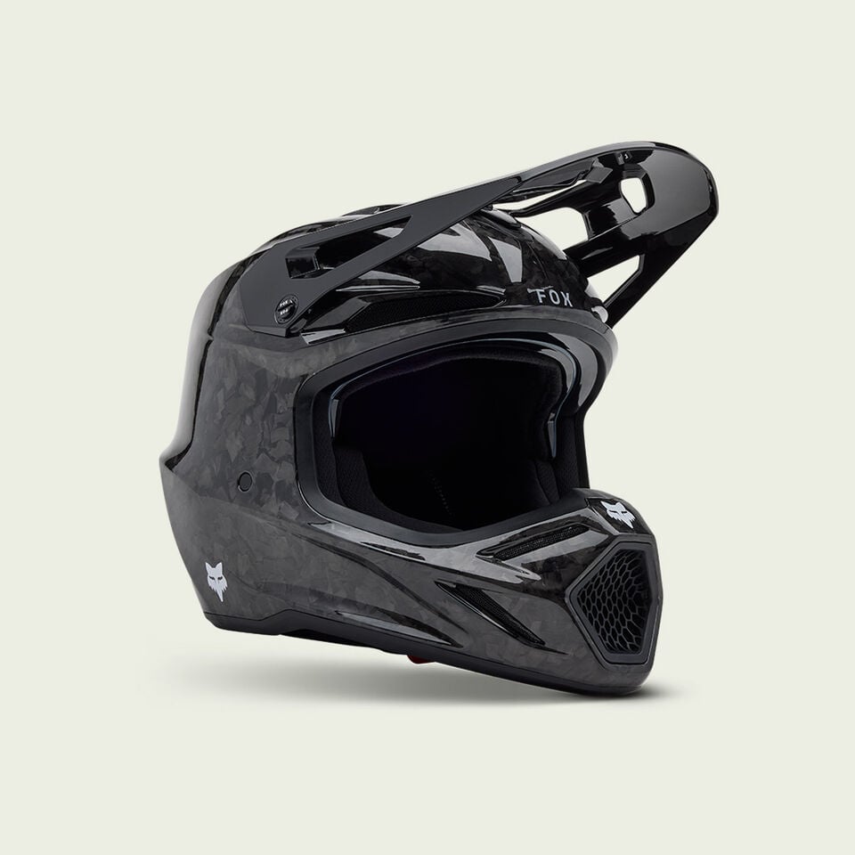 Black V3RS motocross helmet on a white background.