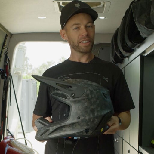 Person cleaning a helmet