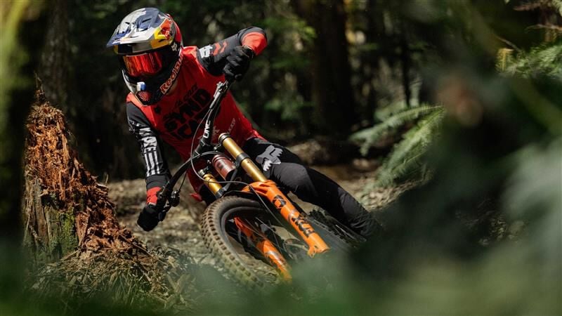 Rider going downhill on a bike with the Rampage RS helmet