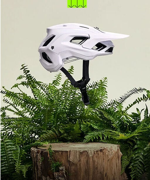 Speedframe bike helmet floating with vegetation in the back