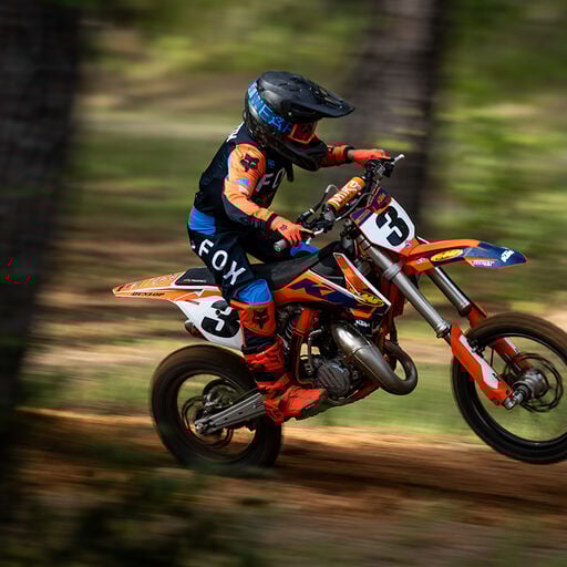 kid riding a dirt bike