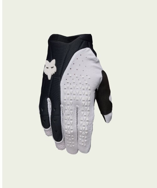 black and white glove on green background