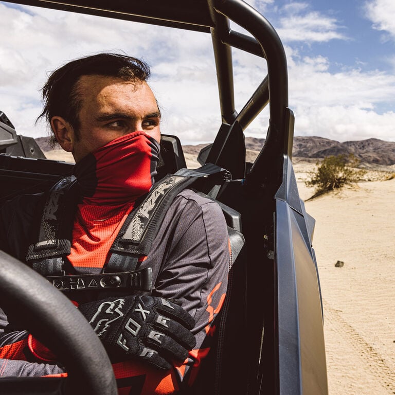 Man wearing a red Ranger Drive jersey with face mask on