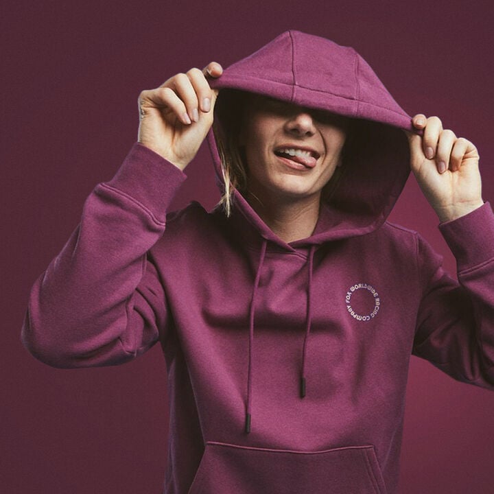 Woman wearing a red flannel over a black shirt.