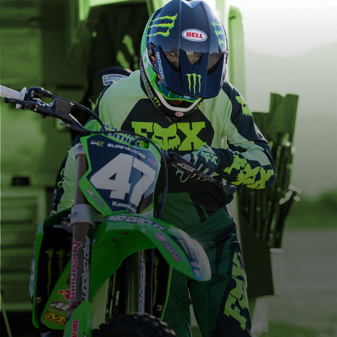 Guy doing a wheelie on a dirt bike